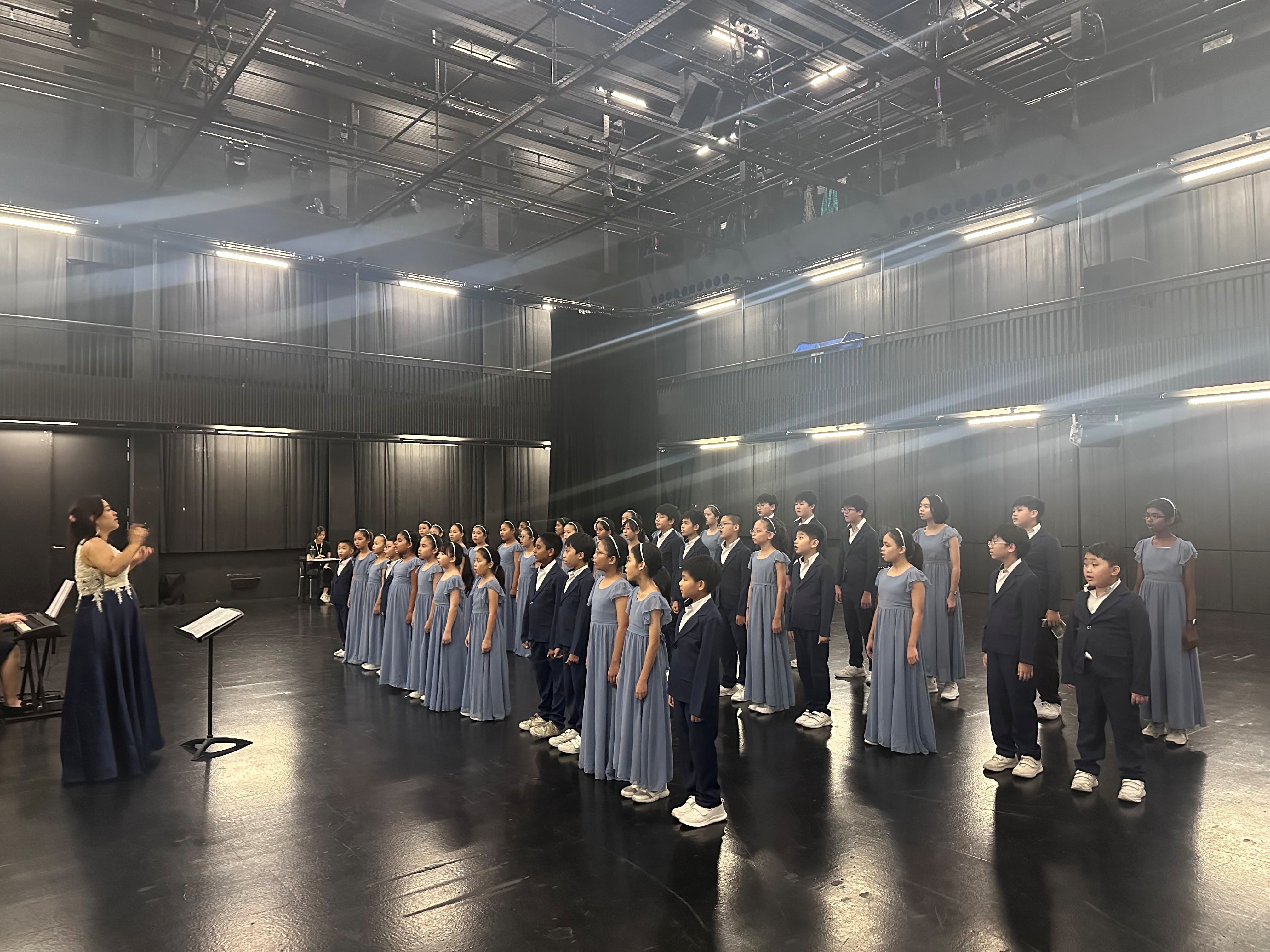 Choir students rehearsing